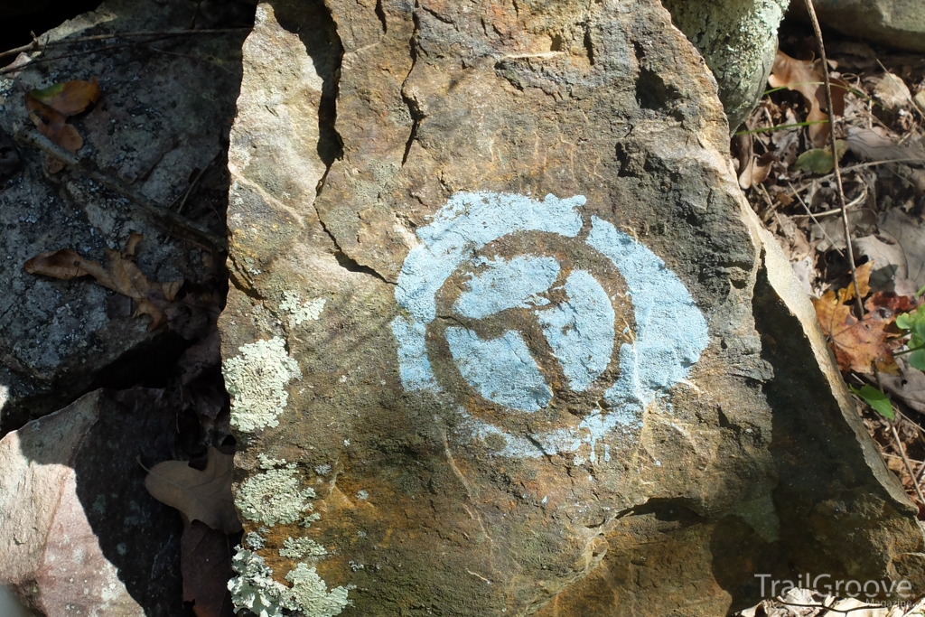 Trail blazes are painted on rocks as well as trees of the Ouachita National Forest.